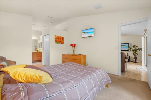 a bedroom with a bed and window