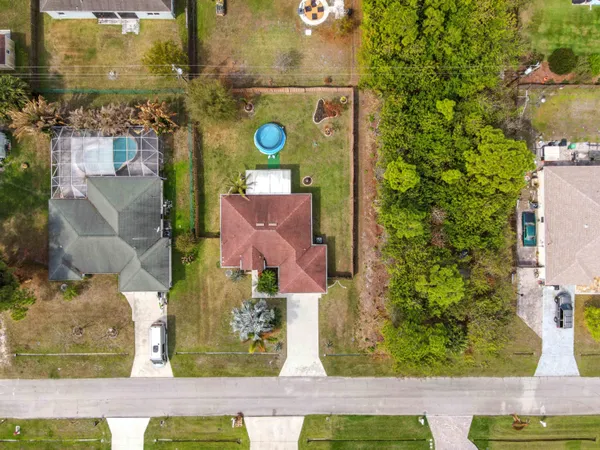 an aerial view of residential houses with outdoor space