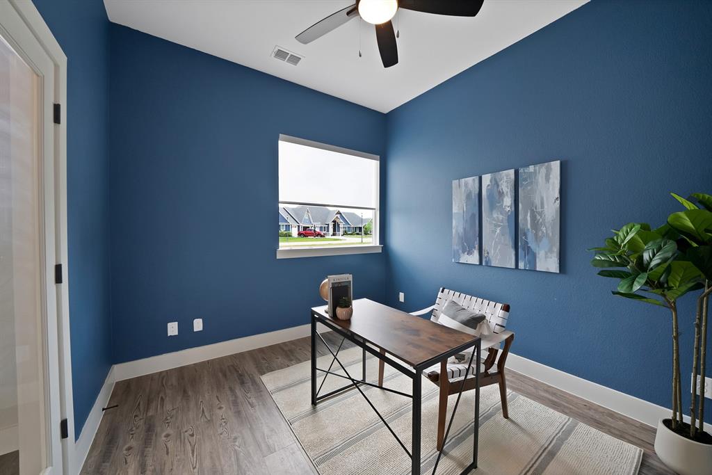 2223 Providence Way Nevada, TX 75173 - Photo 10 of 40 a workspace room with furniture and a potted plant
