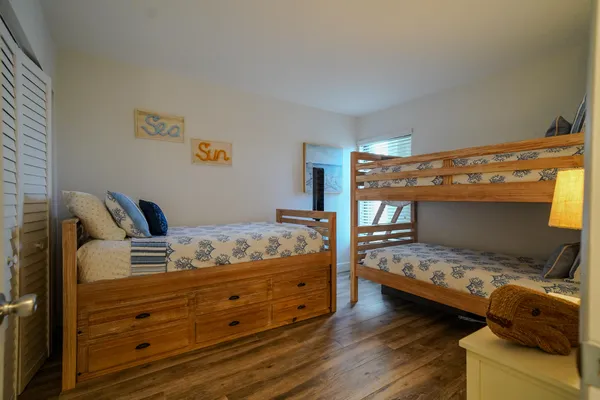 a bedroom with bed and a window