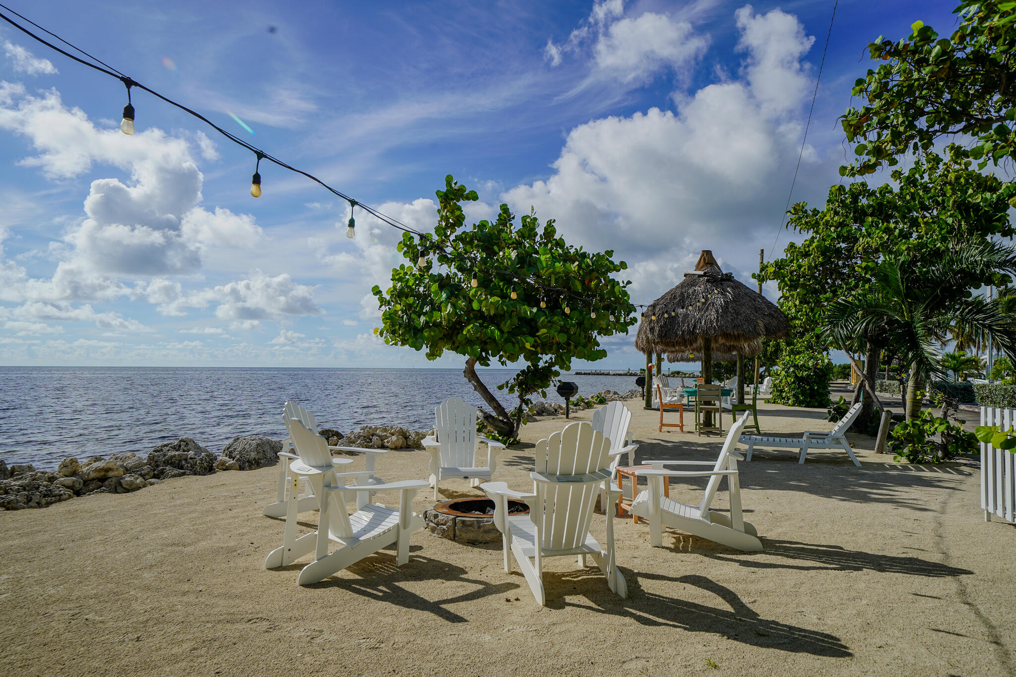 1500 Ocean Bay Drive, Unit H5 Key Largo, FL 33037 - Photo 22 of 24 a view of backyard with seating space and trees in the background