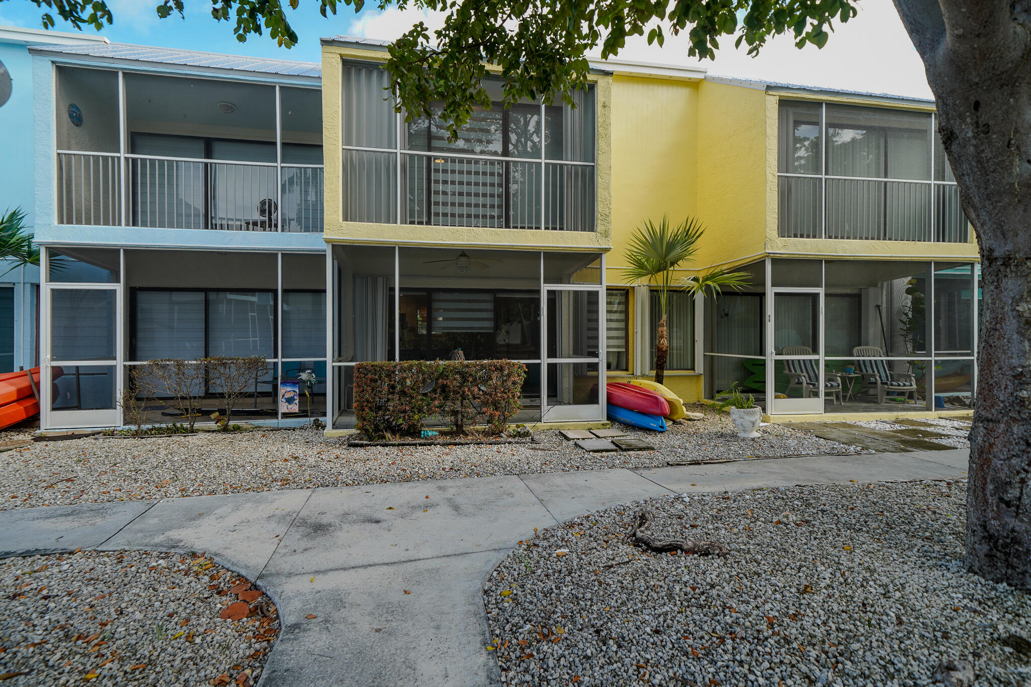 1500 Ocean Bay Drive, Unit H5 Key Largo, FL 33037 - Photo 5 of 24 a view of a house with a floor and a yard