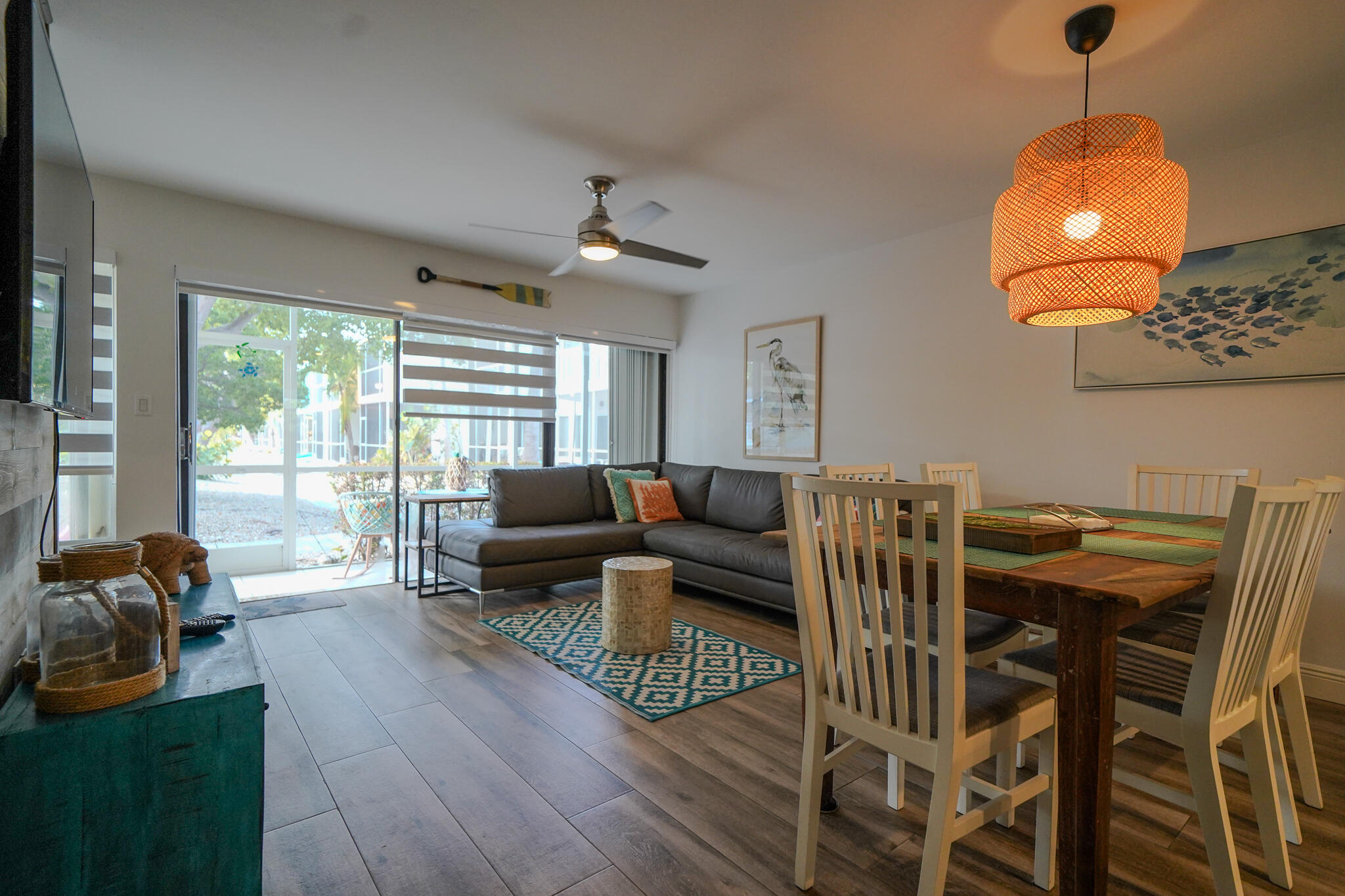 1500 Ocean Bay Drive, Unit H5 Key Largo, FL 33037 - Photo 7 of 24 a living room with furniture a ceiling fan and a large window