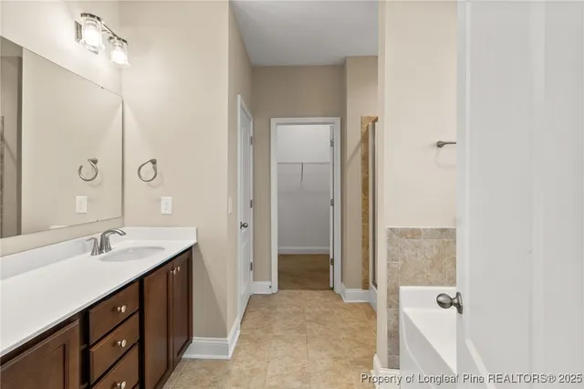 a bathroom with a double vanity sink and mirror with shower