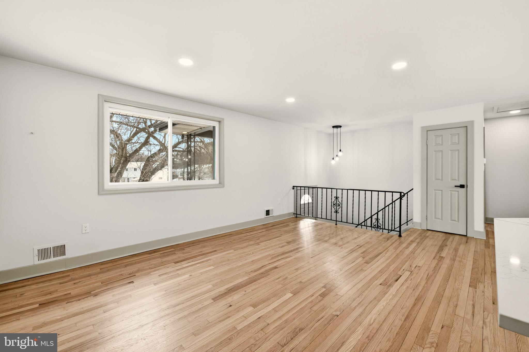 5717 Colon Terrace Temple Hills, MD 20748 - Photo 11 of 32 a view of an empty room with wooden floor and a window