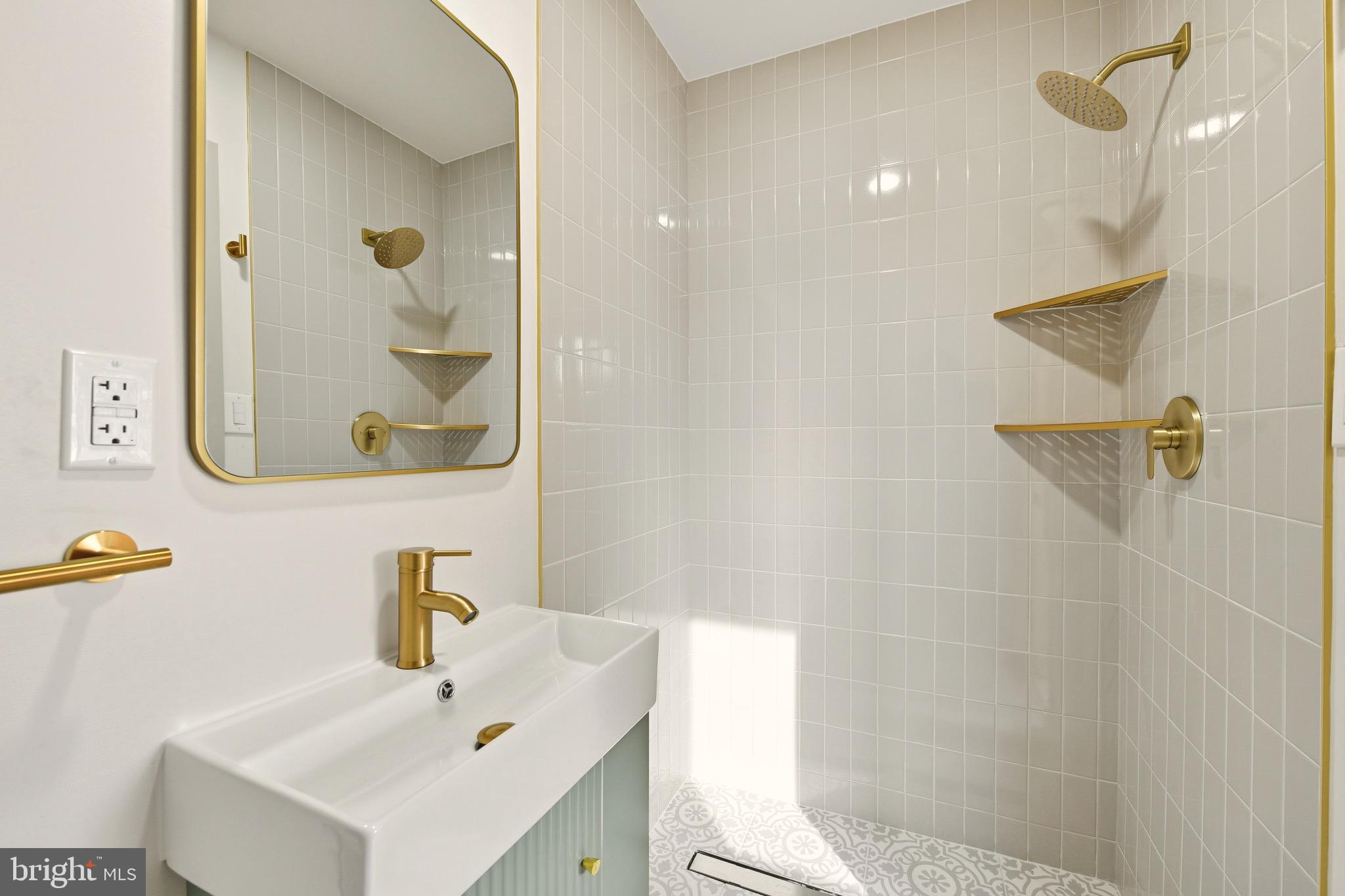 5717 Colon Terrace Temple Hills, MD 20748 - Photo 20 of 32 a bathroom with a sink and a mirror