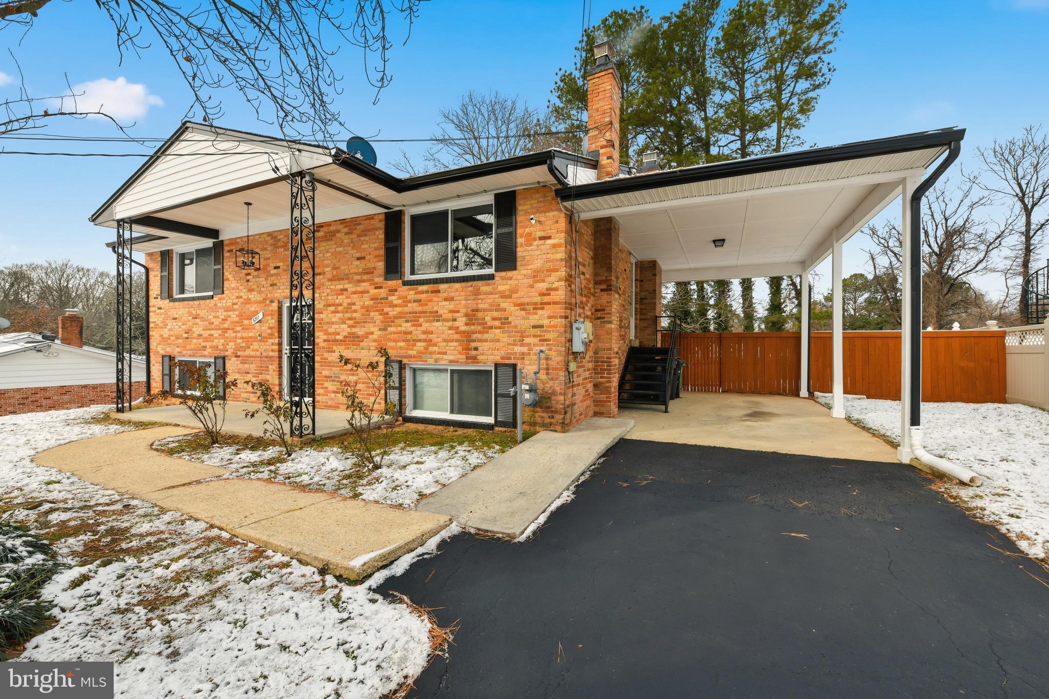 5717 Colon Terrace Temple Hills, MD 20748 - Photo 2 of 32 a front view of a house with yard