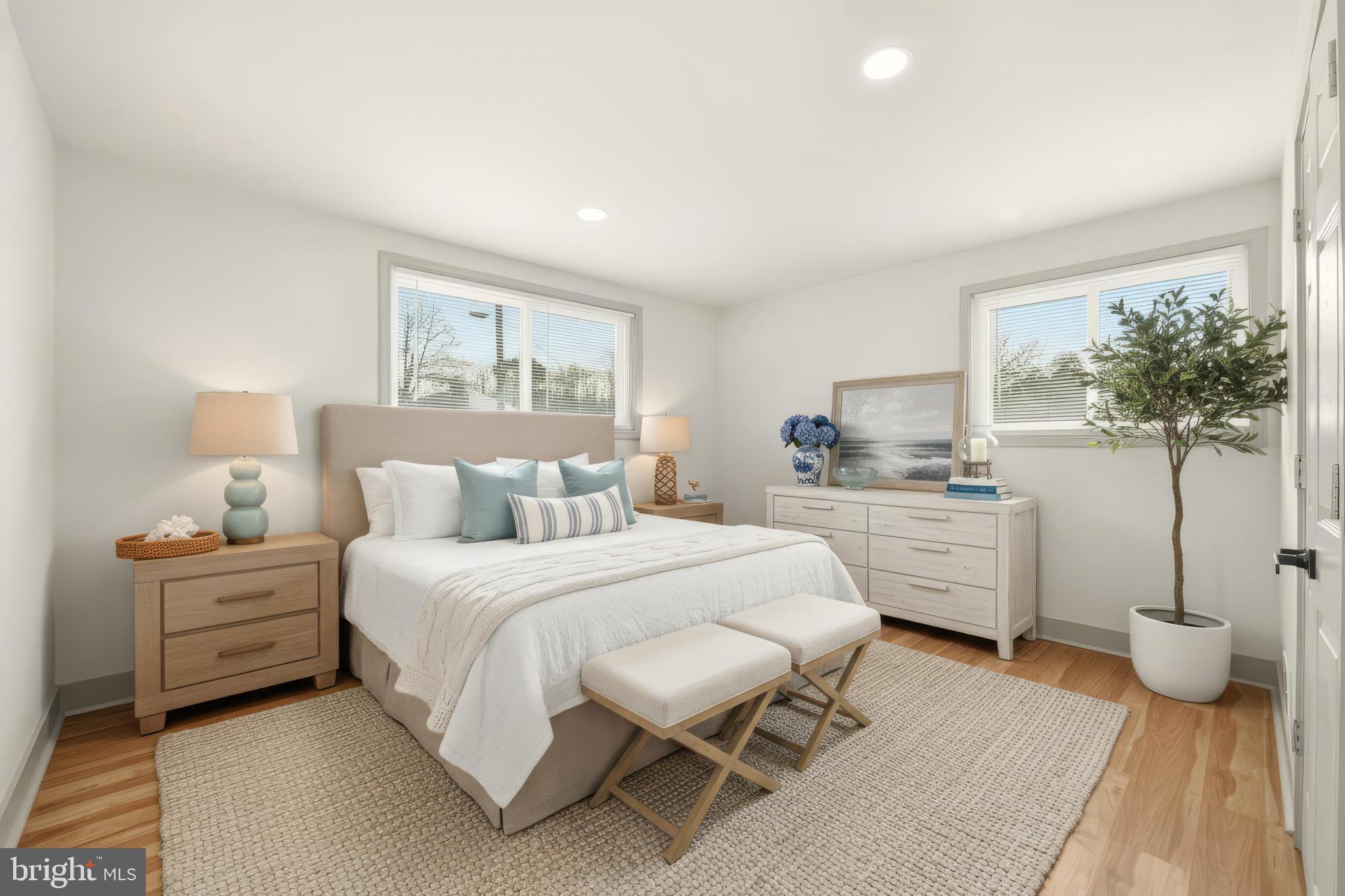 5717 Colon Terrace Temple Hills, MD 20748 - Photo 22 of 32 a bedroom with a bed and a night stand
