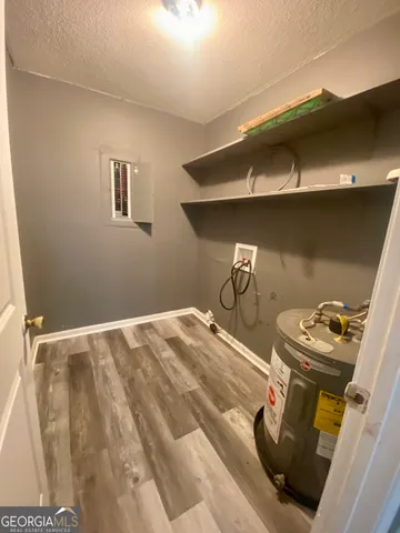 a bedroom with a bed and cabinets