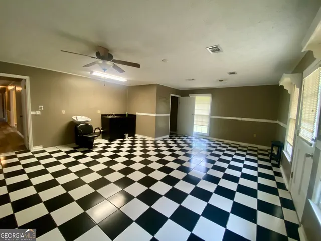 a room with a black white checkered floor and a black white checkered floor