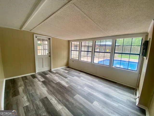 a view of an empty room and window