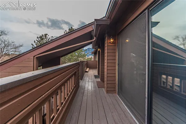 a balcony view with wooden floor