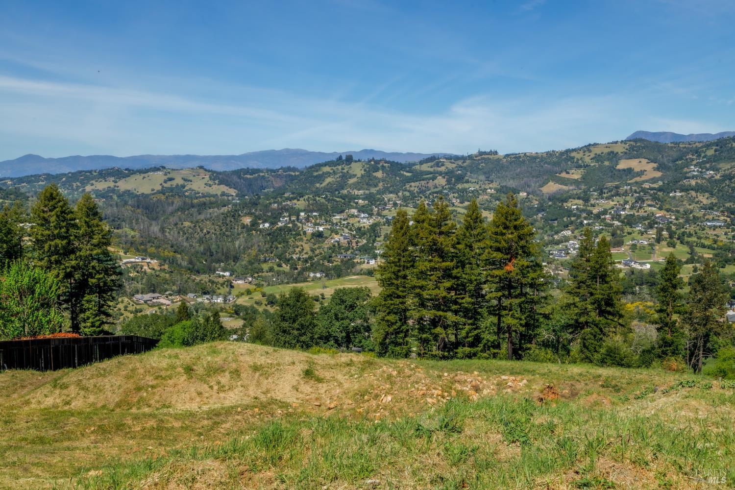 3888 Skyfarm Drive Santa Rosa, CA 95403 - Photo 12 of 18 a view of a yard with a mountain in the background