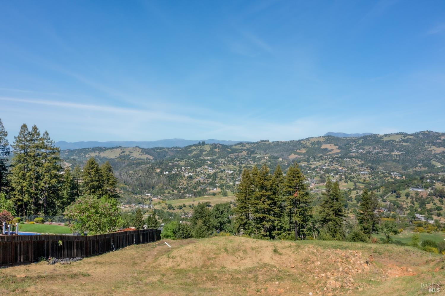3888 Skyfarm Drive Santa Rosa, CA 95403 - Photo 4 of 18 a view of a forest with mountains in the background