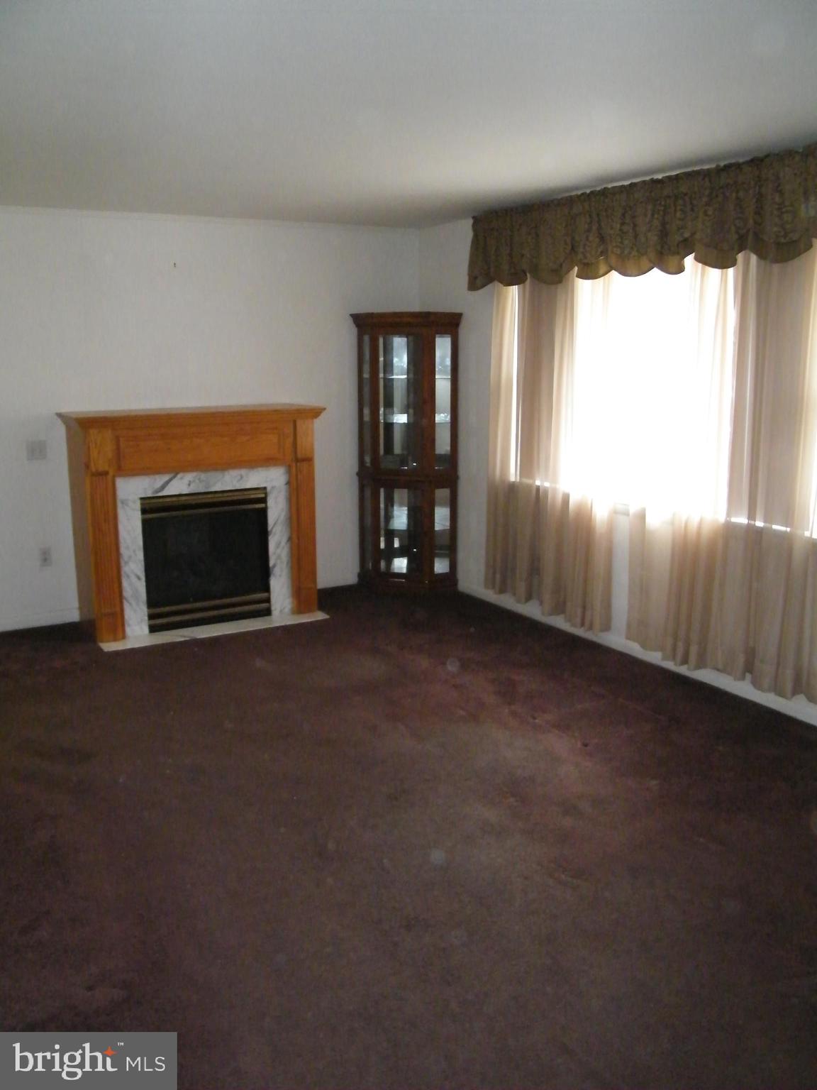 26 South Ritters Lane Owings Mills, MD 21117 - Photo 9 of 29 Livingroom (Wood floors under carpet)