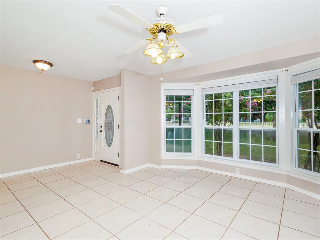 4002 Austin Avenue Brownwood, TX 76801 - Photo 3 of 34 a view of an entryway with wooden floor