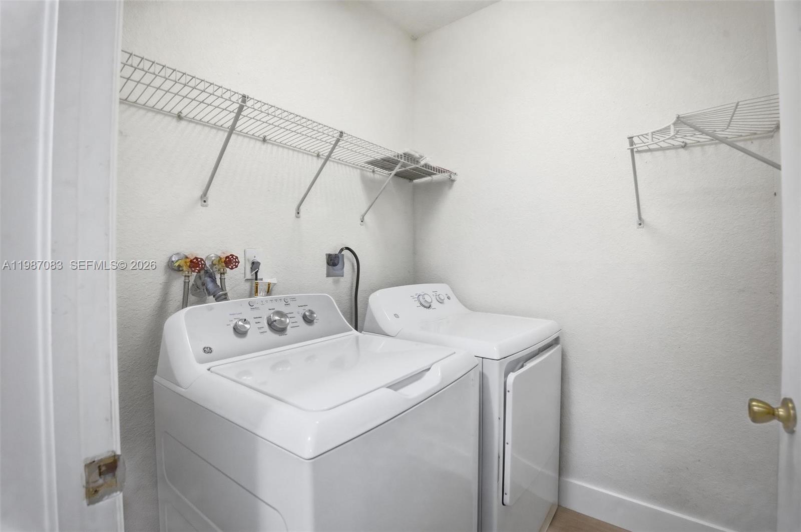 16131 Southwest 151st Terrace Miami, FL 33196 - Photo 18 of 55 a utility room with dryer and washer