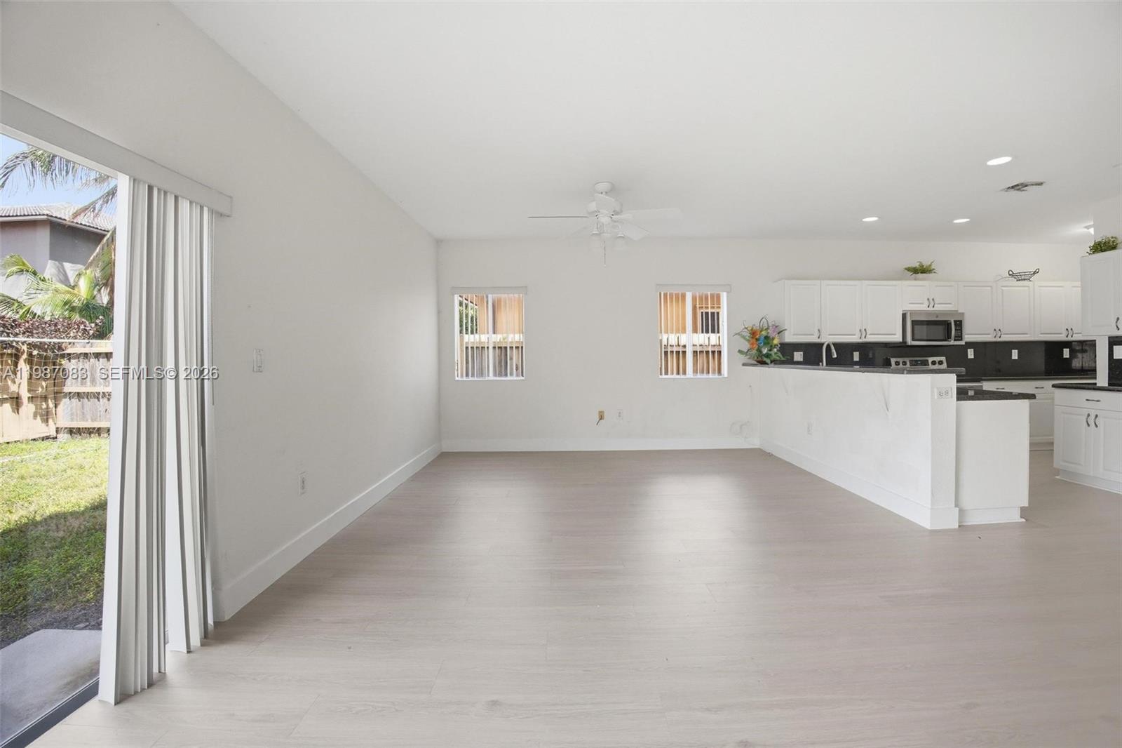 16131 Southwest 151st Terrace Miami, FL 33196 - Photo 21 of 55 a view of a kitchen with a sink and a window
