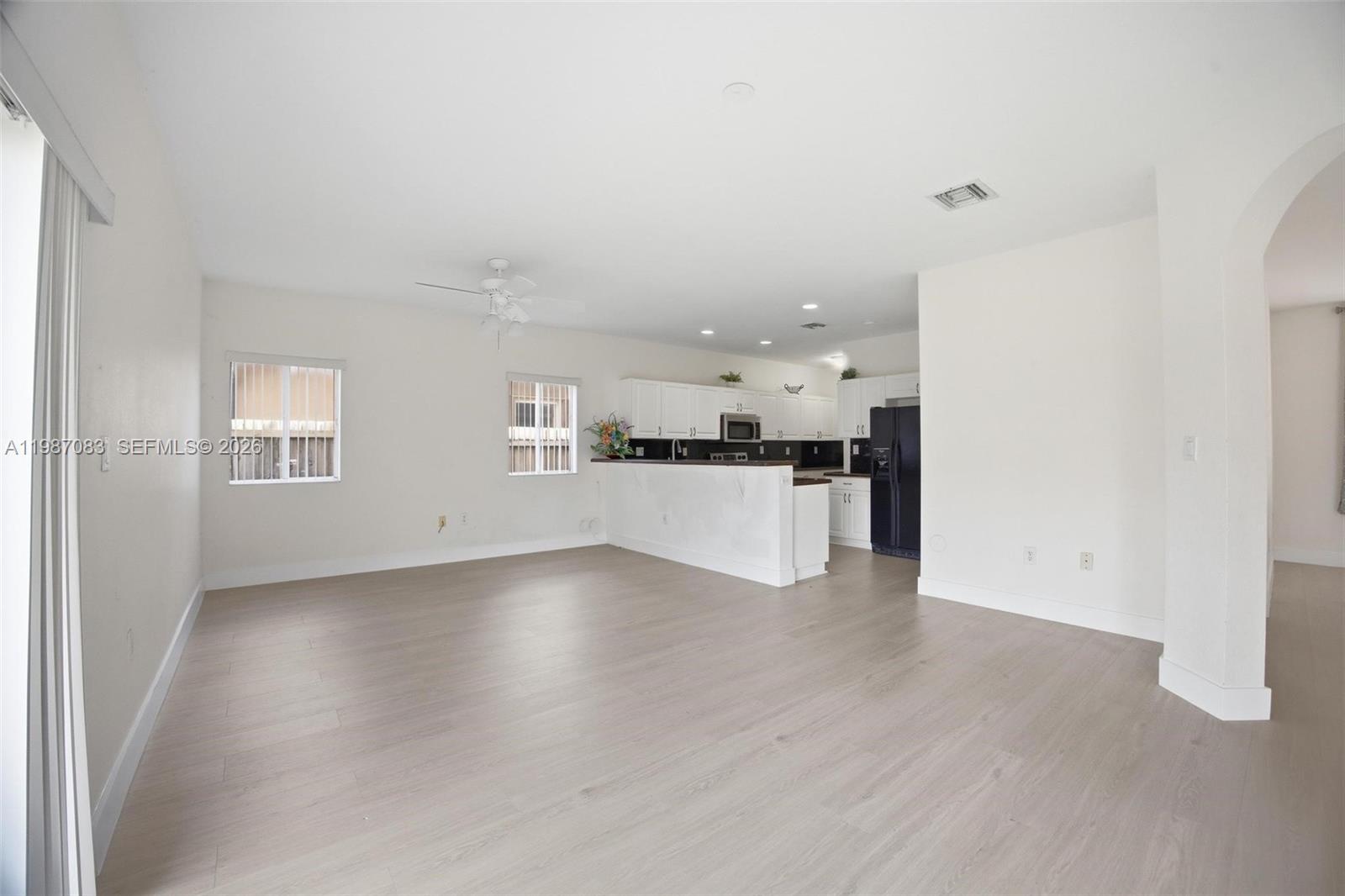 16131 Southwest 151st Terrace Miami, FL 33196 - Photo 22 of 55 a view of a kitchen with a sink and dishwasher kitchen view with wooden floor