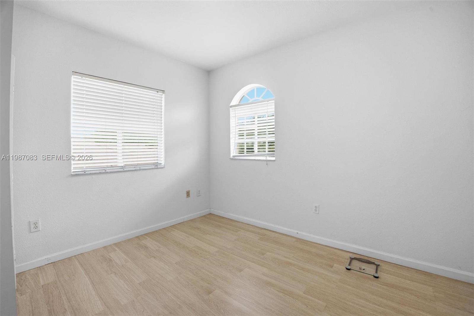 16131 Southwest 151st Terrace Miami, FL 33196 - Photo 32 of 55 an empty room with a window