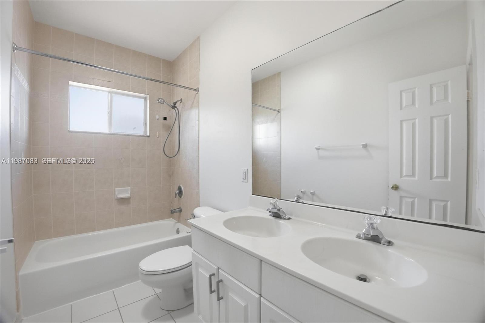 16131 Southwest 151st Terrace Miami, FL 33196 - Photo 34 of 55 a bathroom with a sink a toilet and shower