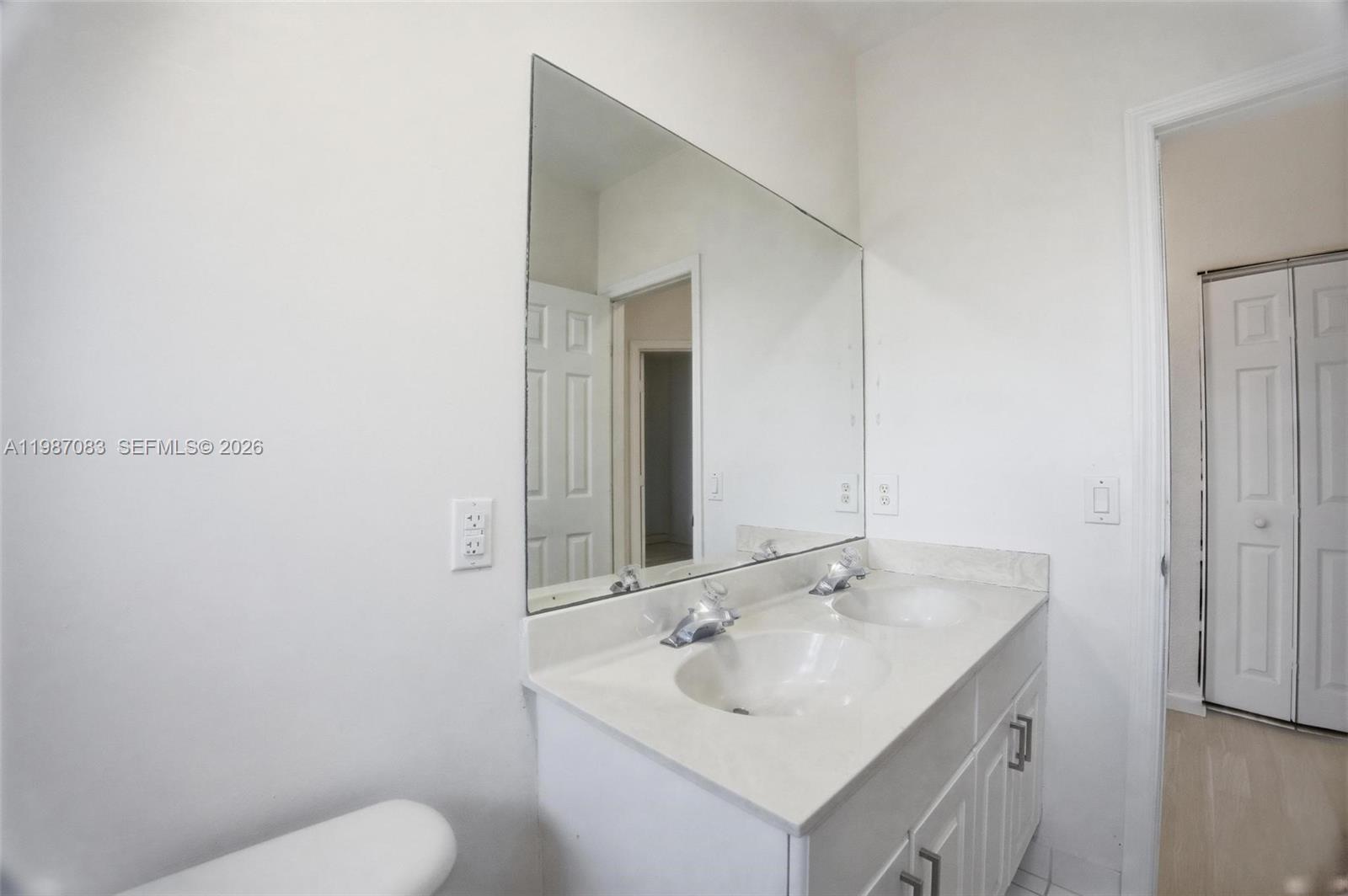 16131 Southwest 151st Terrace Miami, FL 33196 - Photo 35 of 55 a bathroom with a sink and a toilet