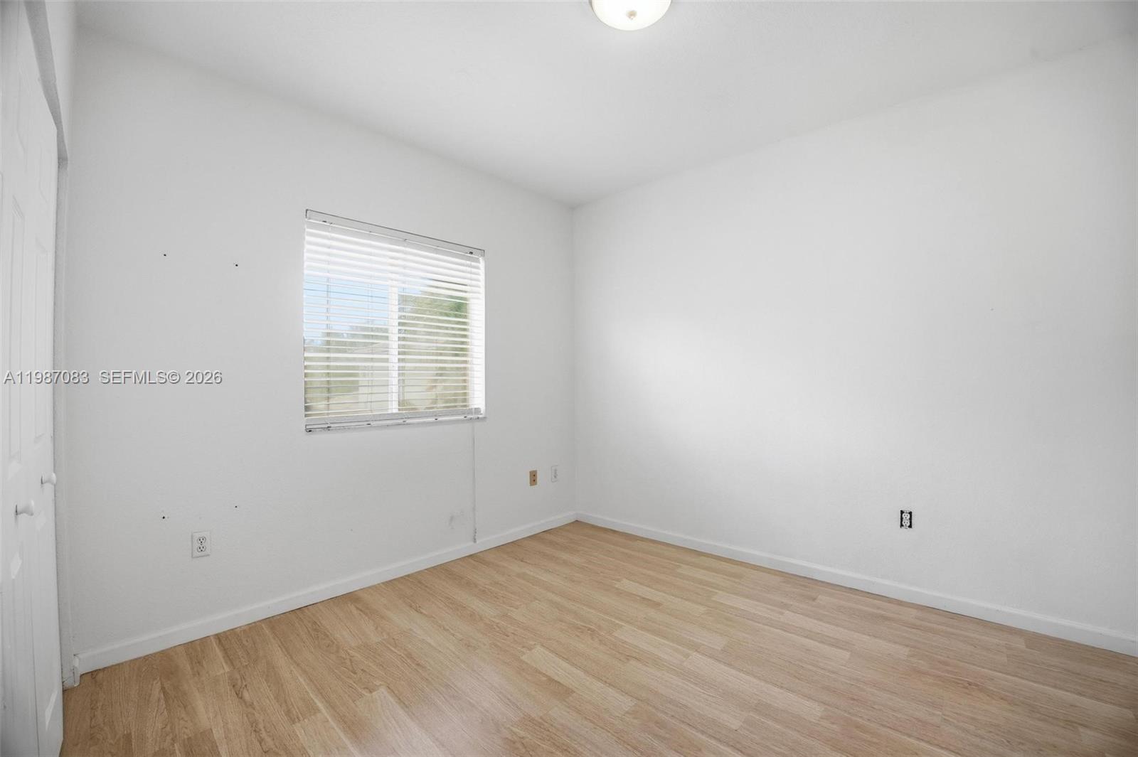16131 Southwest 151st Terrace Miami, FL 33196 - Photo 36 of 55 an empty room with a window
