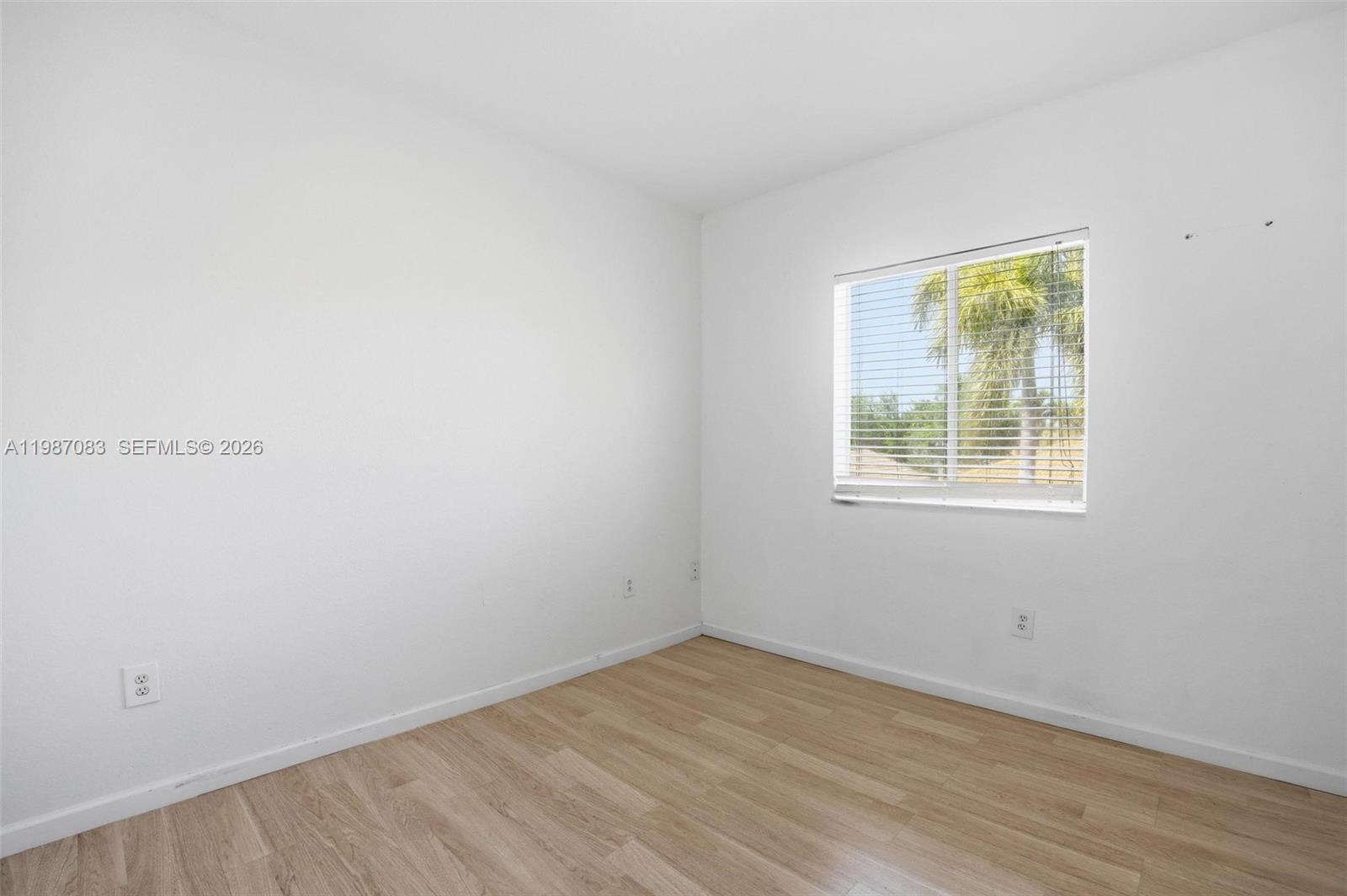 16131 Southwest 151st Terrace Miami, FL 33196 - Photo 38 of 55 an empty room with a window