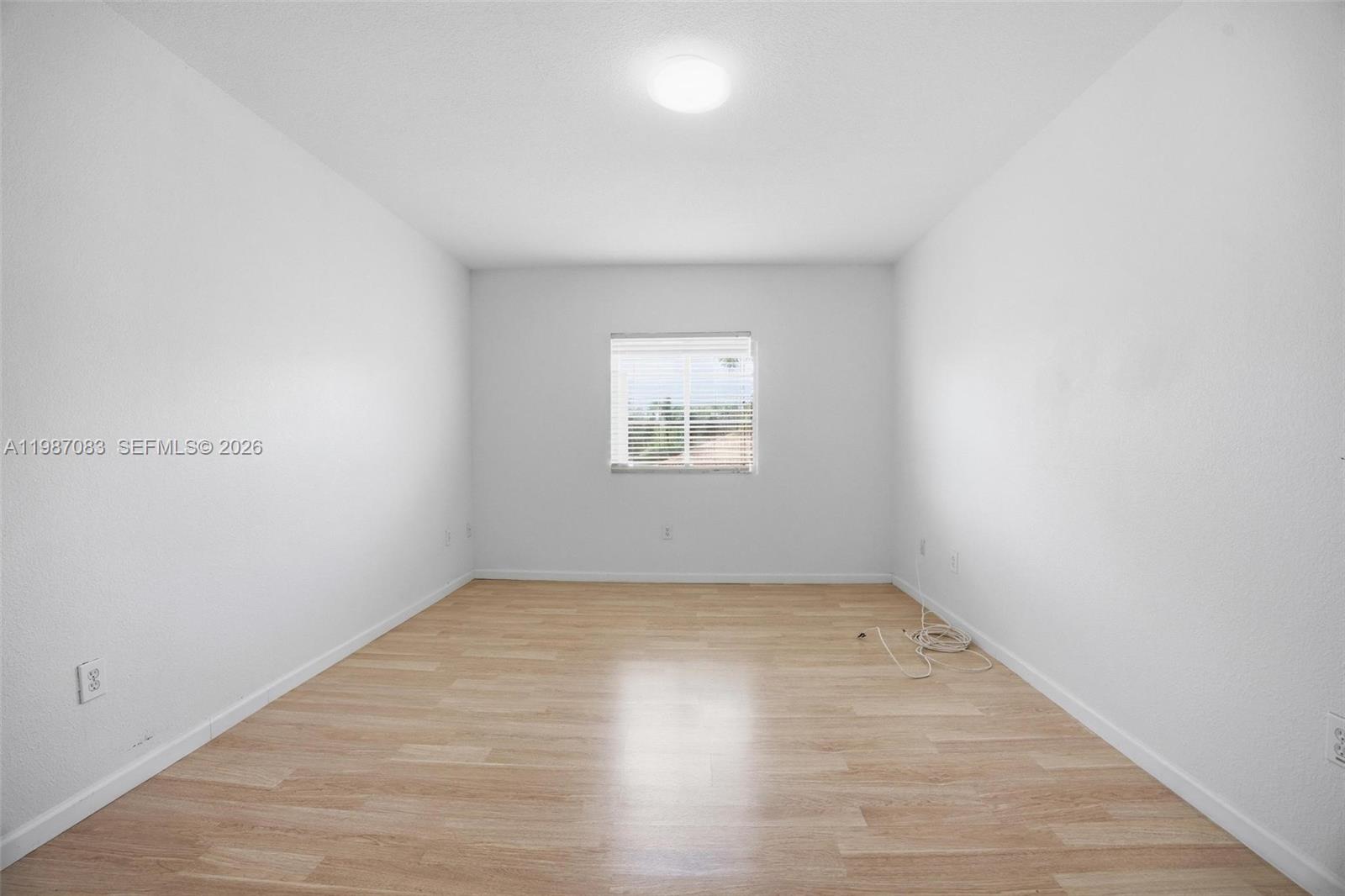 16131 Southwest 151st Terrace Miami, FL 33196 - Photo 41 of 55 an empty room with a window