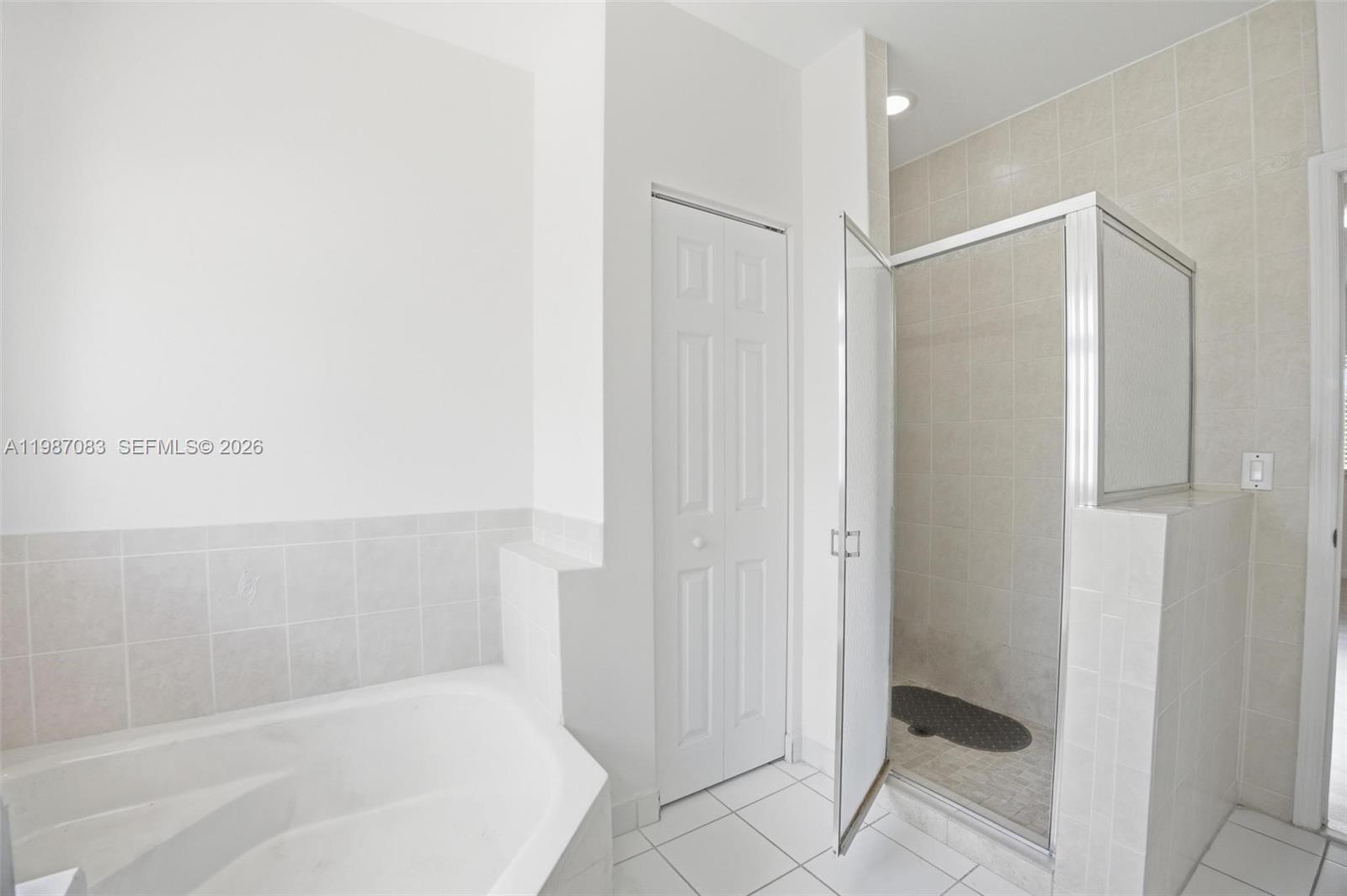 16131 Southwest 151st Terrace Miami, FL 33196 - Photo 45 of 55 a bathroom with a bathtub and shower