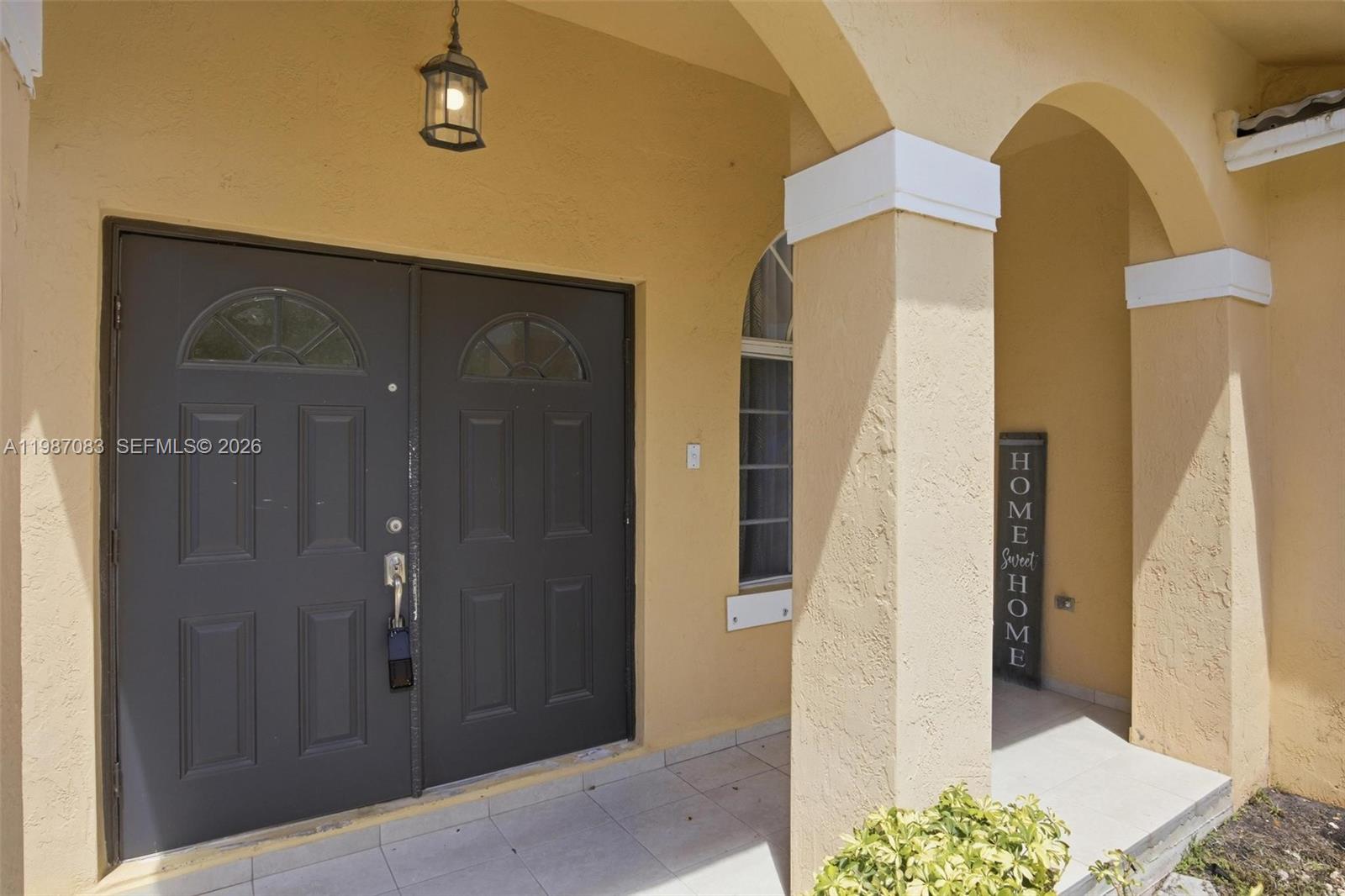 16131 Southwest 151st Terrace Miami, FL 33196 - Photo 5 of 55 a bathroom with a glass door shower and a sink
