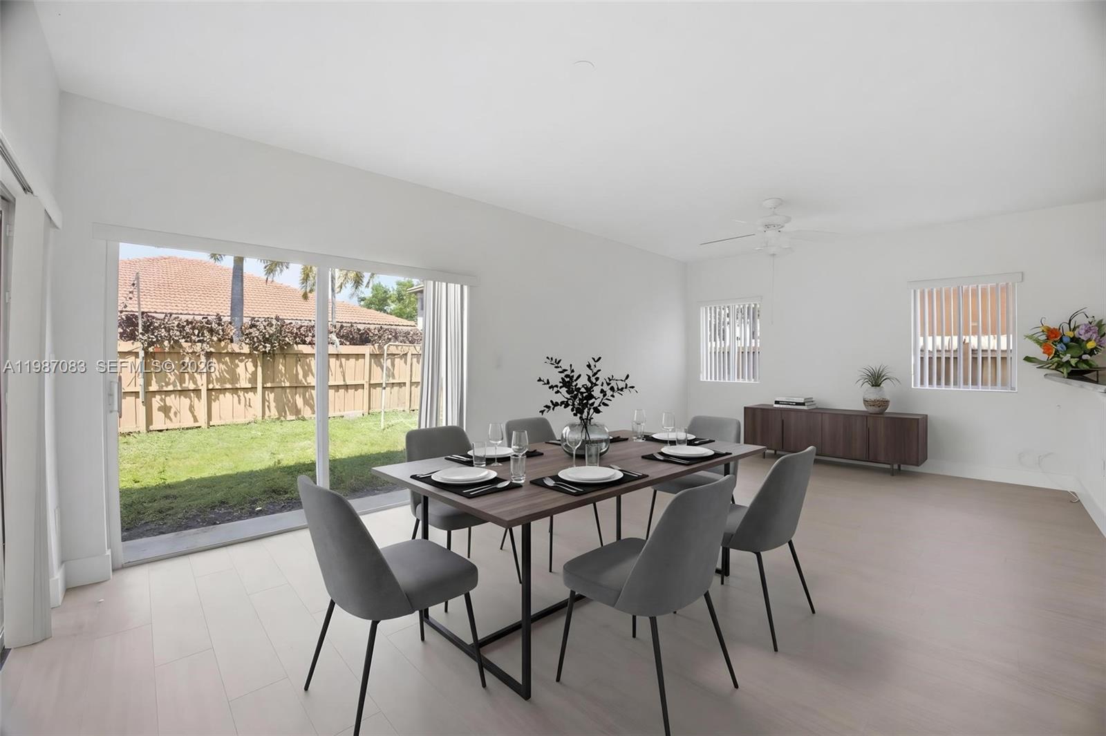 16131 Southwest 151st Terrace Miami, FL 33196 - Photo 51 of 55 a view of a dining room with furniture and a potted plant
