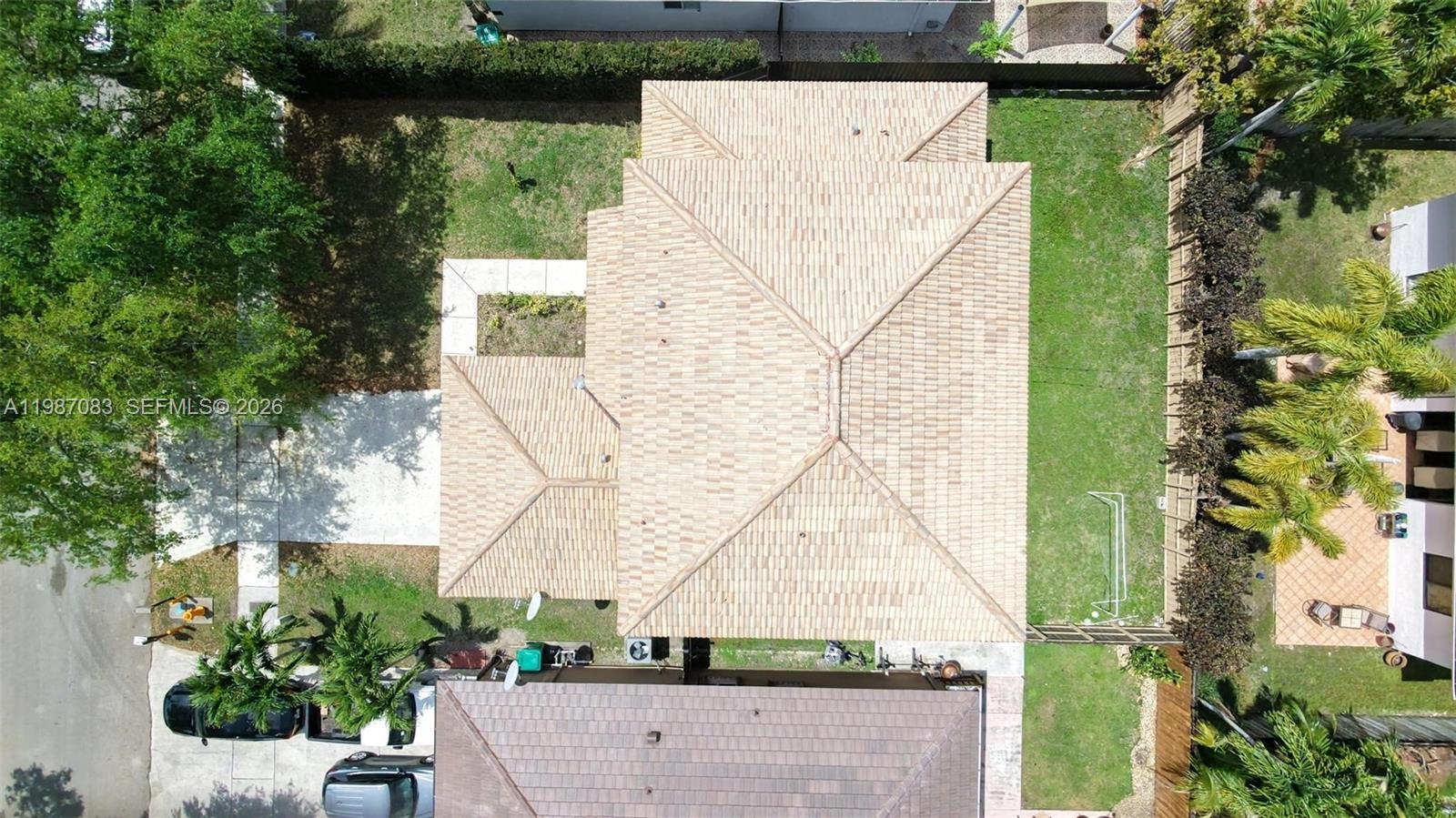 16131 Southwest 151st Terrace Miami, FL 33196 - Photo 52 of 55 an aerial view of a house with a yard and potted plants