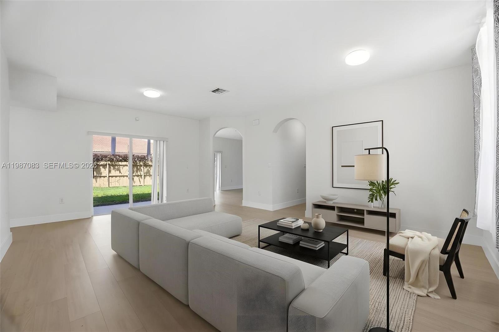 16131 Southwest 151st Terrace Miami, FL 33196 - Photo 53 of 55 a living room with furniture window and wooden floor