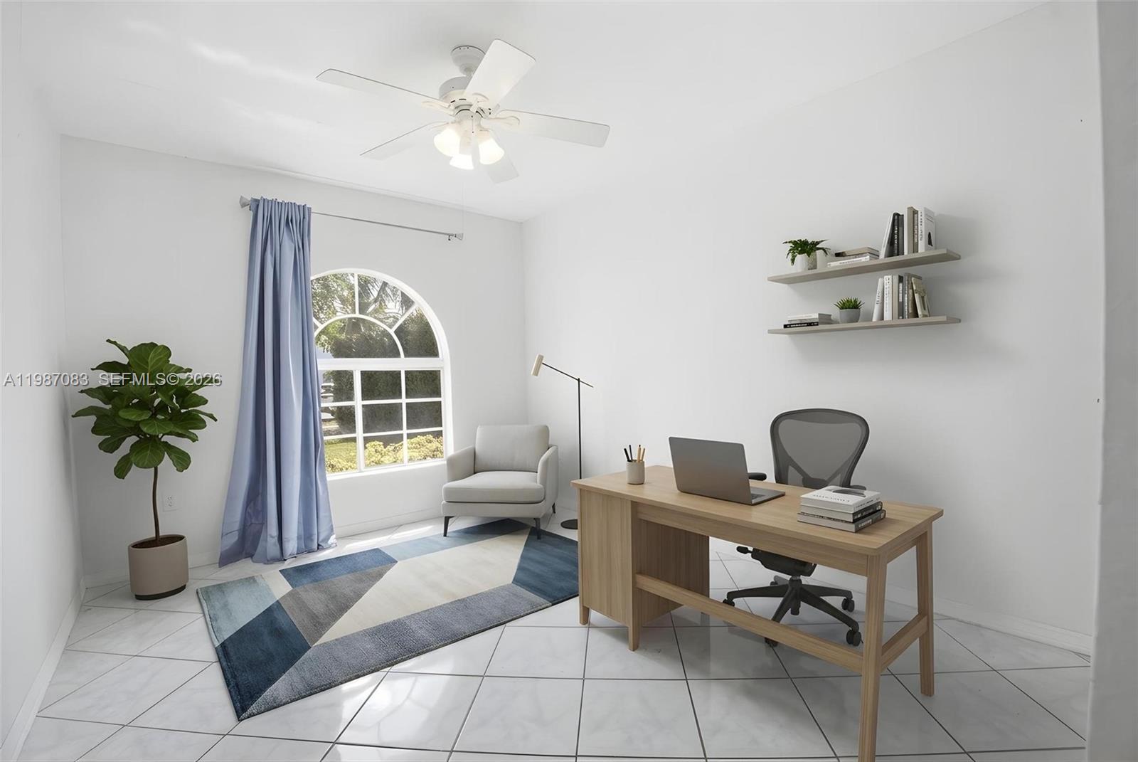 16131 Southwest 151st Terrace Miami, FL 33196 - Photo 54 of 55 a living room with furniture and a potted plant