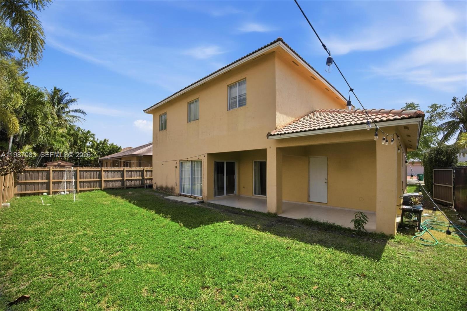 16131 Southwest 151st Terrace Miami, FL 33196 - Photo 8 of 55 a view of a house with backyard and porch