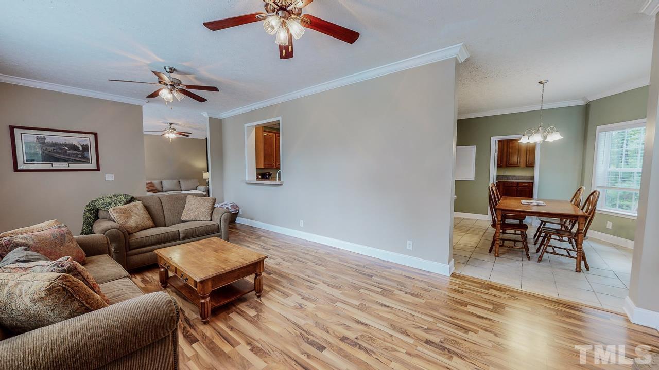 125 Adams Farm Road Roxboro, NC 27574 - Photo 14 of 30 a living room with furniture a dining table and a piano