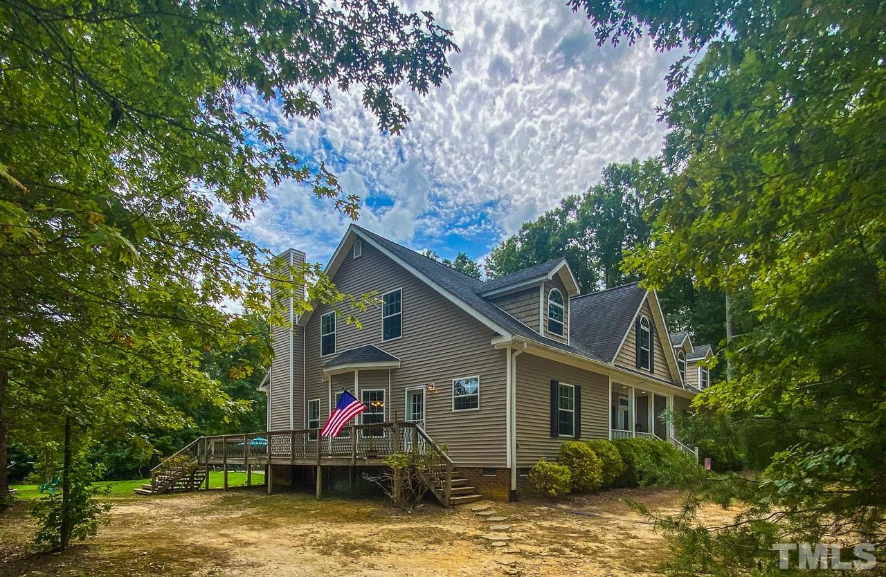 125 Adams Farm Road Roxboro, NC 27574 - Photo 17 of 30 a view of a house with a chairs in balcony