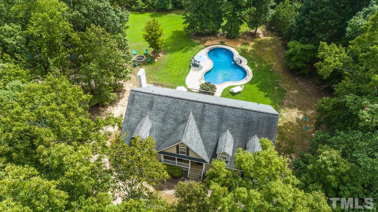 125 Adams Farm Road Roxboro, NC 27574 - Photo 18 of 30 an aerial view of a house with a swimming pool and a yard