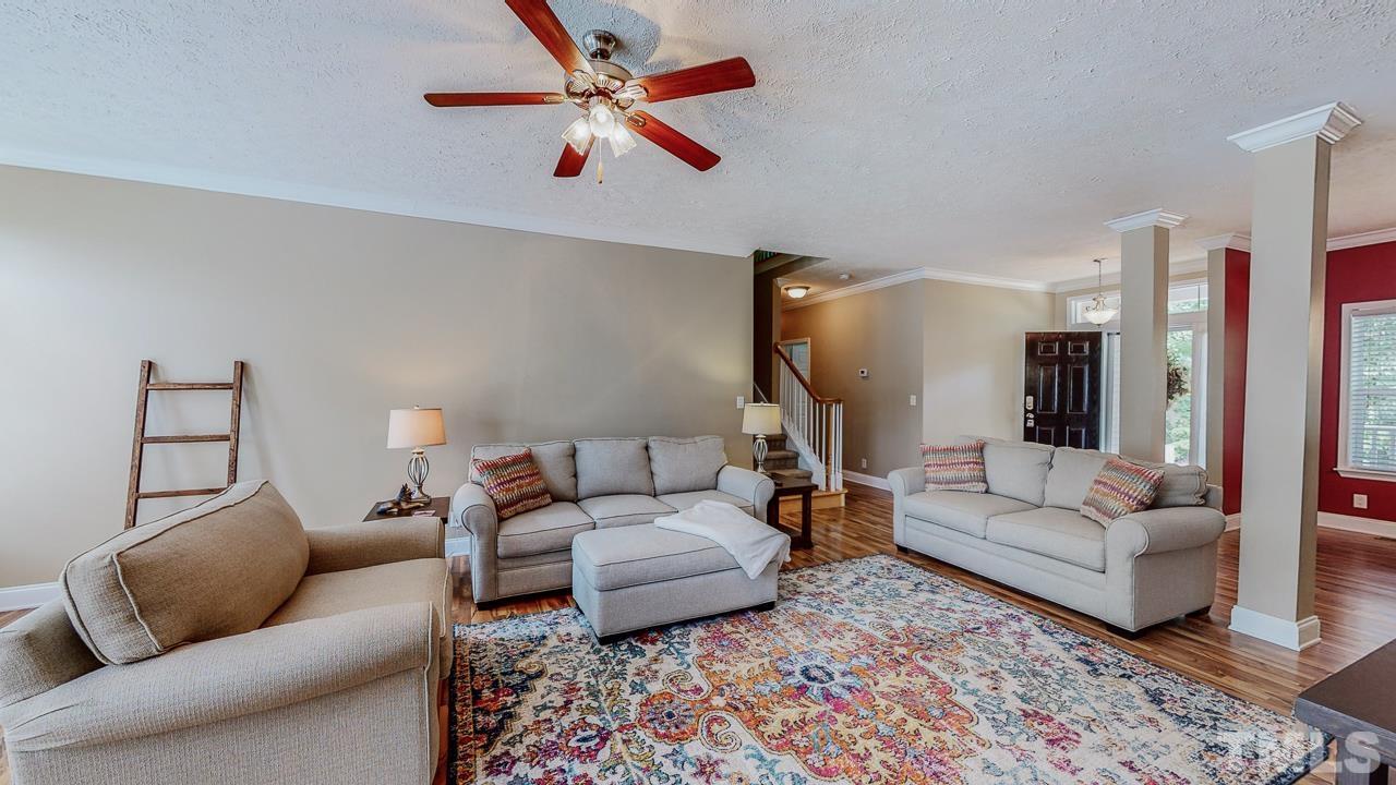 125 Adams Farm Road Roxboro, NC 27574 - Photo 3 of 30 a living room with furniture and a chandelier