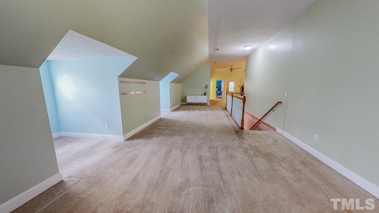 125 Adams Farm Road Roxboro, NC 27574 - Photo 22 of 30 a view of a livingroom with a staircase
