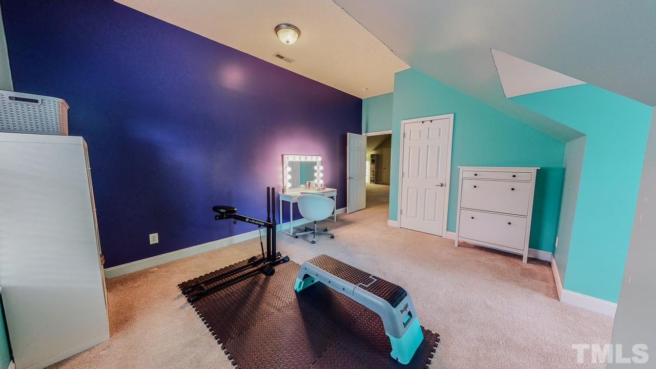 125 Adams Farm Road Roxboro, NC 27574 - Photo 23 of 30 a room with gym equipment and a large window
