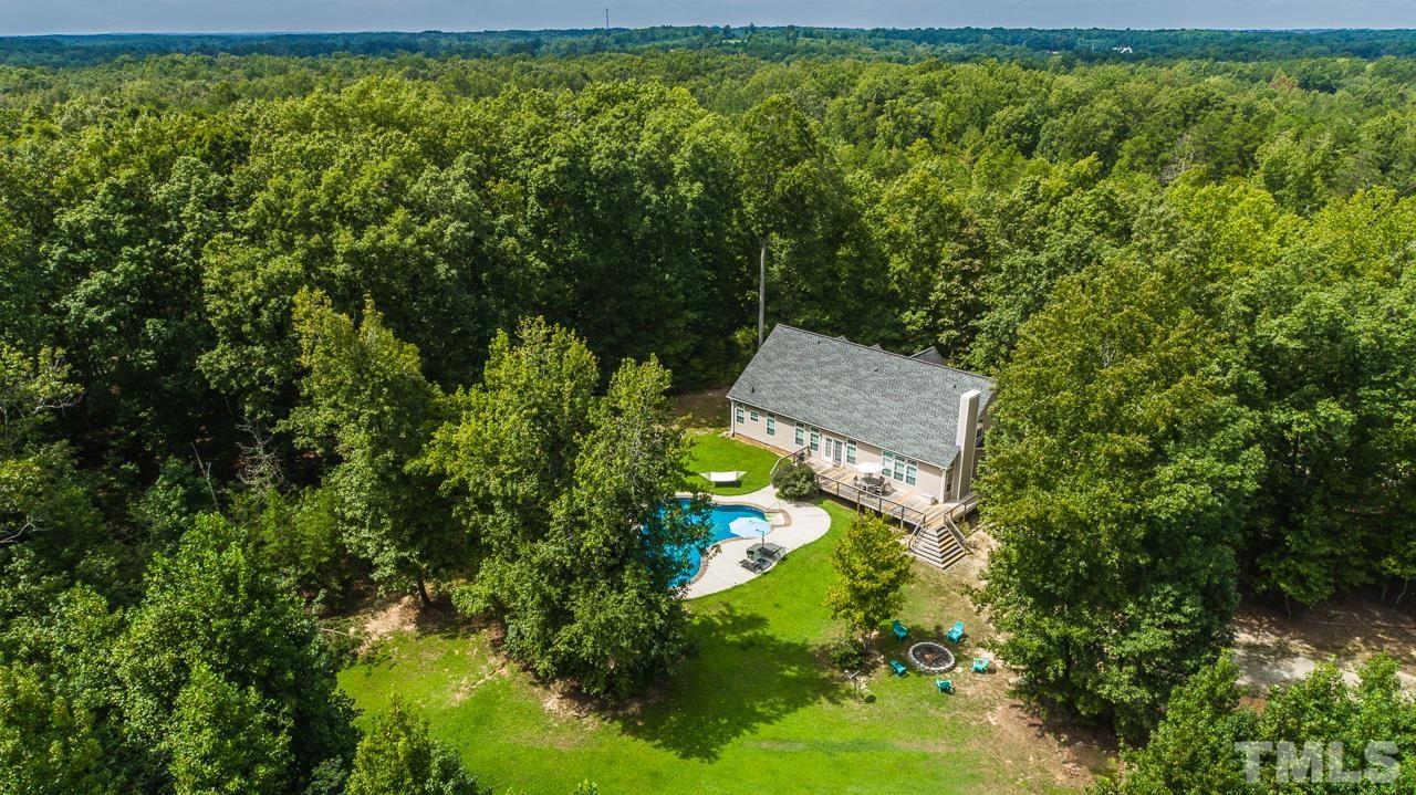 125 Adams Farm Road Roxboro, NC 27574 - Photo 27 of 30 a aerial view of a house with a yard basket ball court and outdoor seating