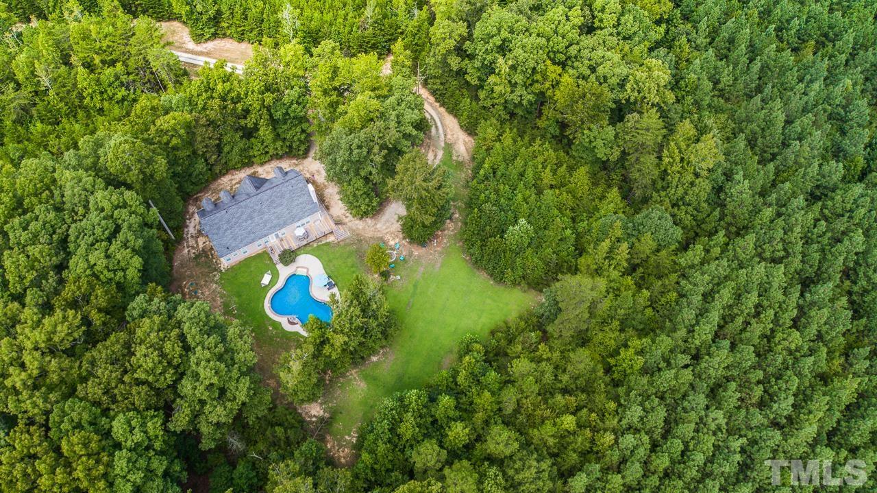 125 Adams Farm Road Roxboro, NC 27574 - Photo 29 of 30 a view of a house with a backyard space