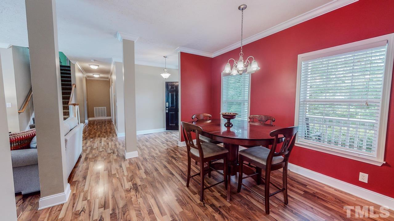 125 Adams Farm Road Roxboro, NC 27574 - Photo 6 of 30 a view of a dining room with furniture and wooden floor