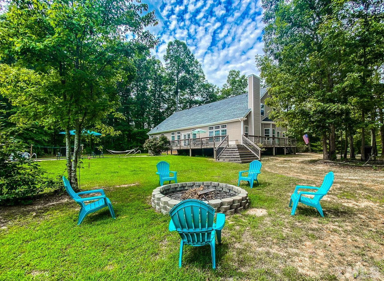 125 Adams Farm Road Roxboro, NC 27574 - Photo 7 of 30 a view of backyard with swimming pool and patio