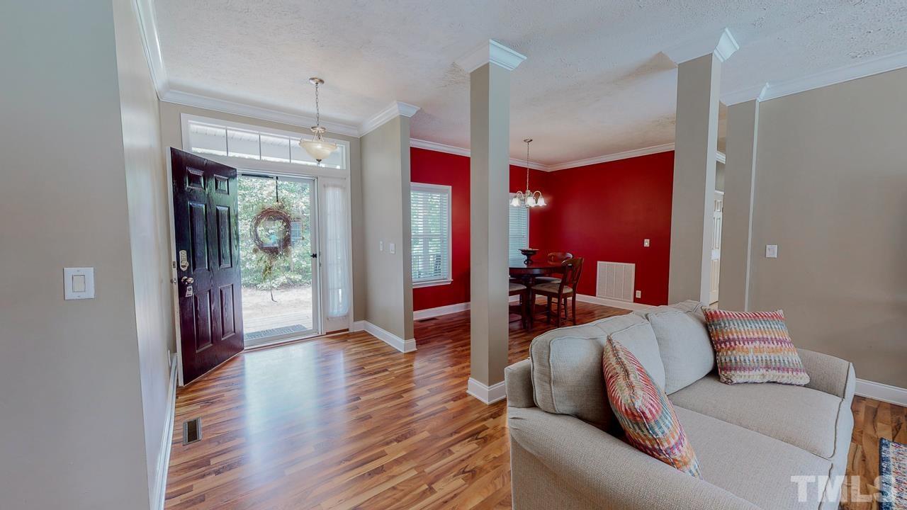 125 Adams Farm Road Roxboro, NC 27574 - Photo 10 of 30 a living room with furniture and a wooden floor