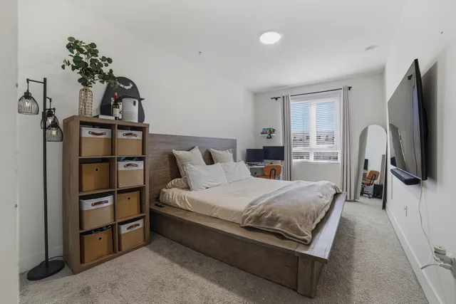 a living room with furniture and a stairs