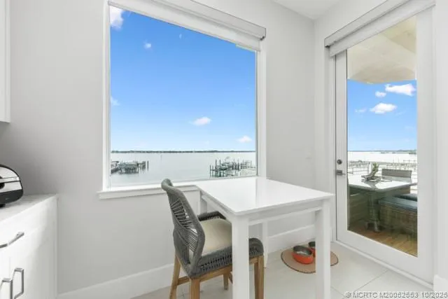 a view of a dining table and chairs