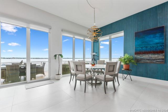 51 Southeast Seminole Street, Unit 305 Stuart, FL 34994 - Photo 17 of 47 a view of a dining room with furniture window and outside view